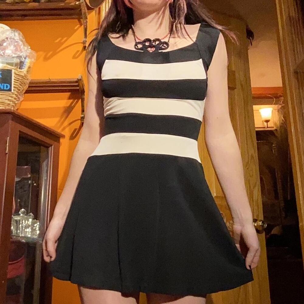 Black and white striped mini dress, no label for what this fabric is, but